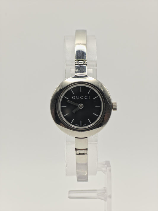 Gucci 105 Women’s Stainless Steel Quartz Watch – Black Dial – Swiss Made – Elegant Bangle Style