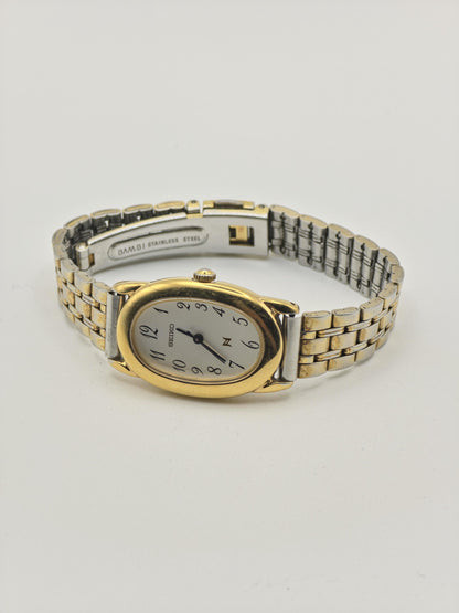 Vintage Seiko Women's Quartz Oval White Dial Two-Tone Dress Watch - 391
